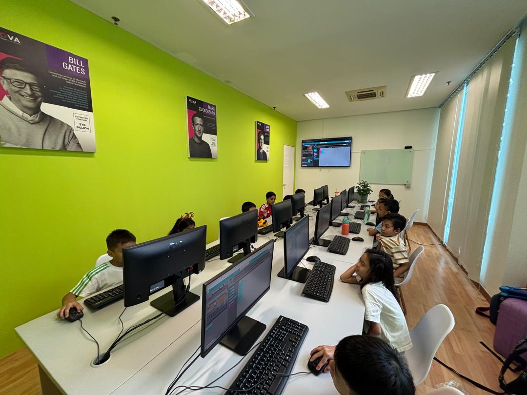 Students working at computer stations in a NOVA classroom
